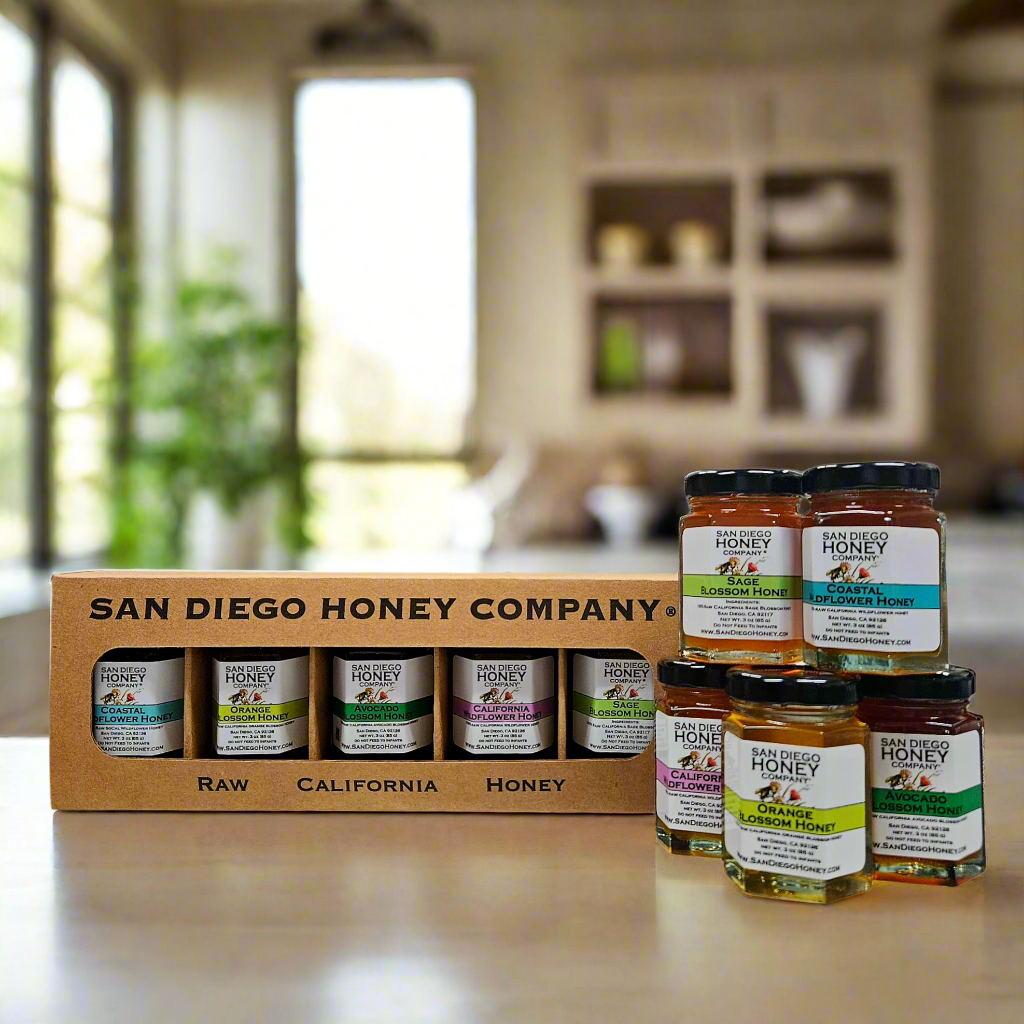 A set of jars of raw honey from San Diego Honey Company, displayed in a gift box.